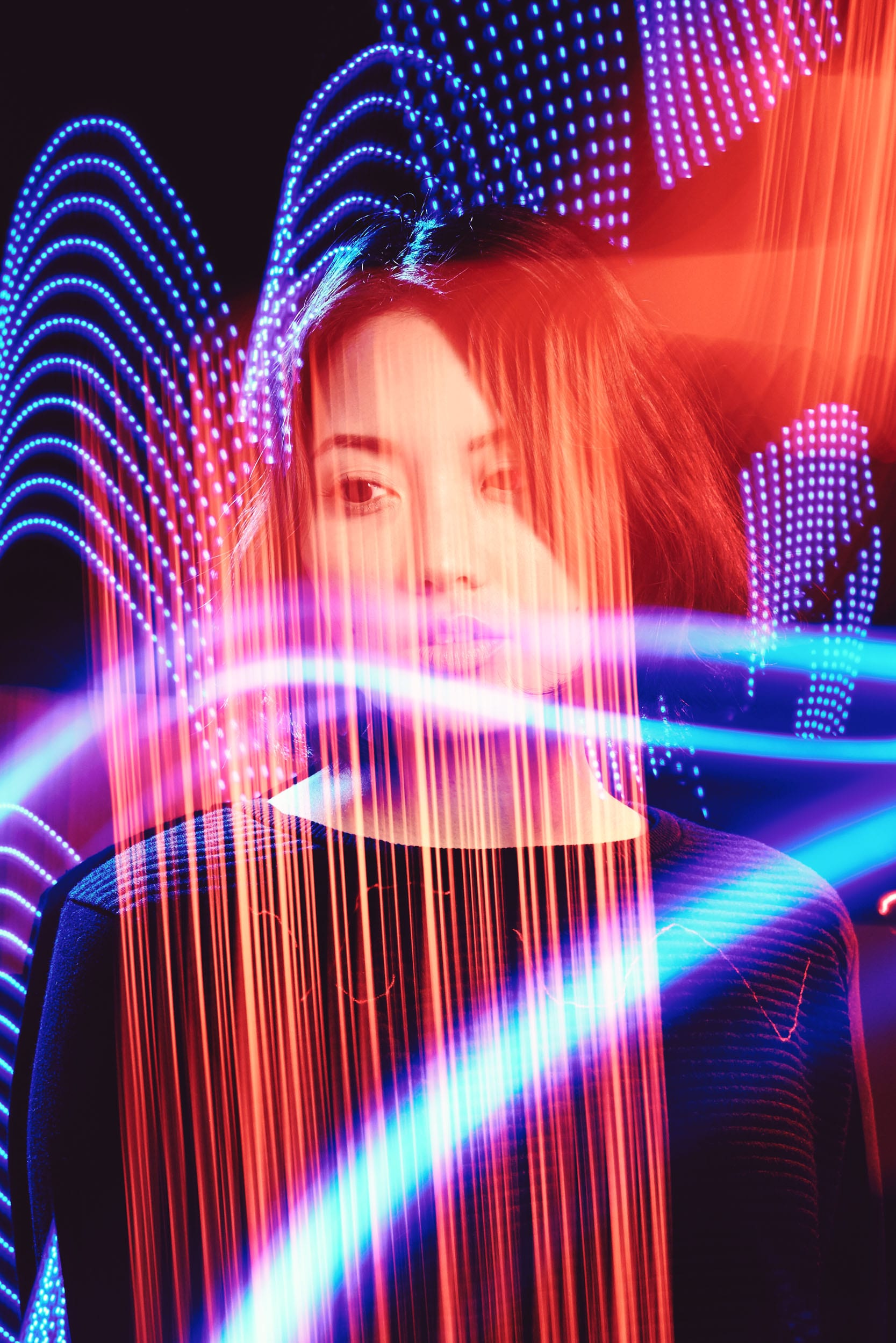 Girl  surrounded by colorful lights